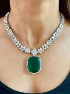 oval emerald with diamond setting pendant set
